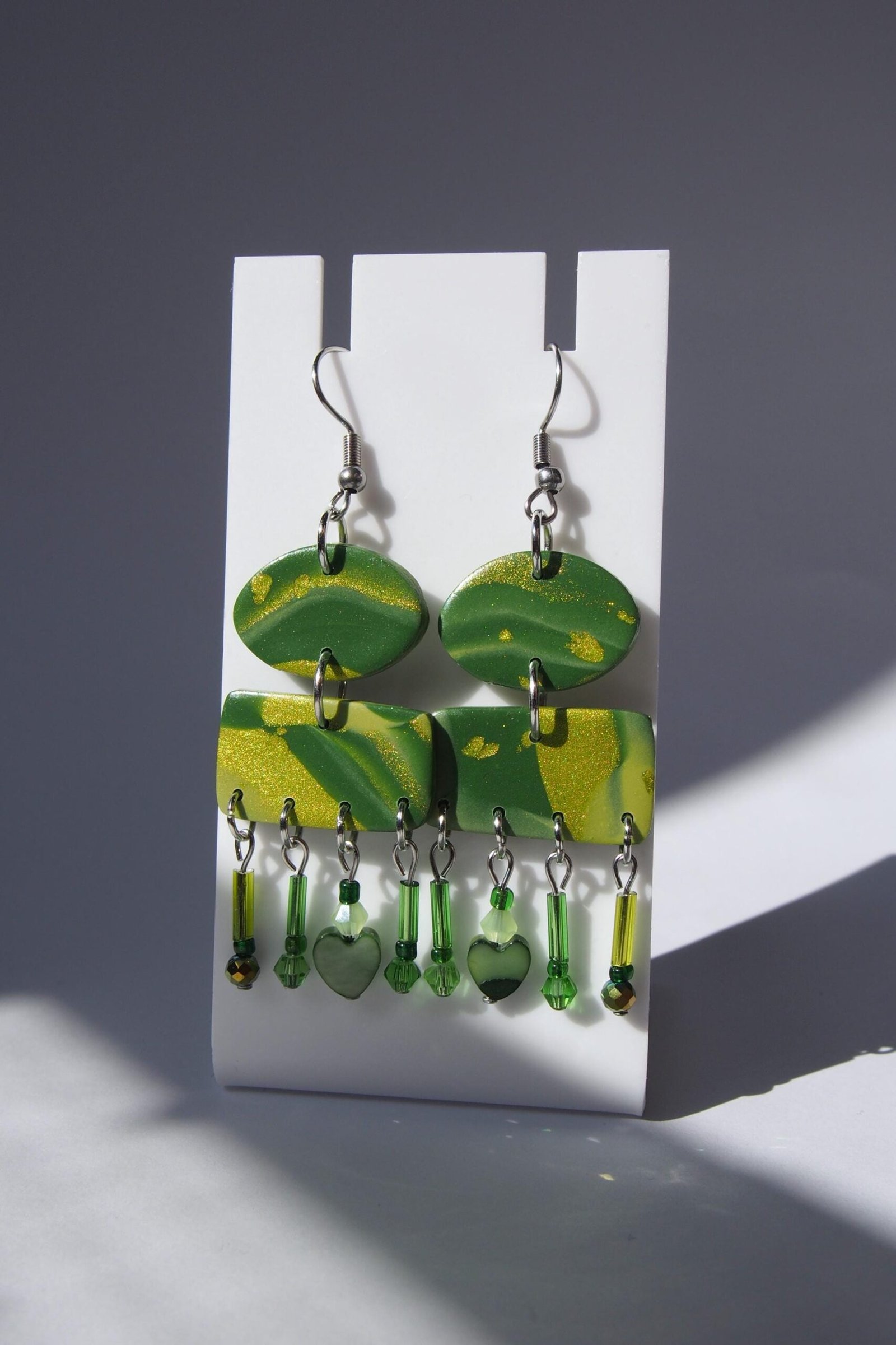 Shimmering Green Boho Earrings: Geometric Heart Dangles
