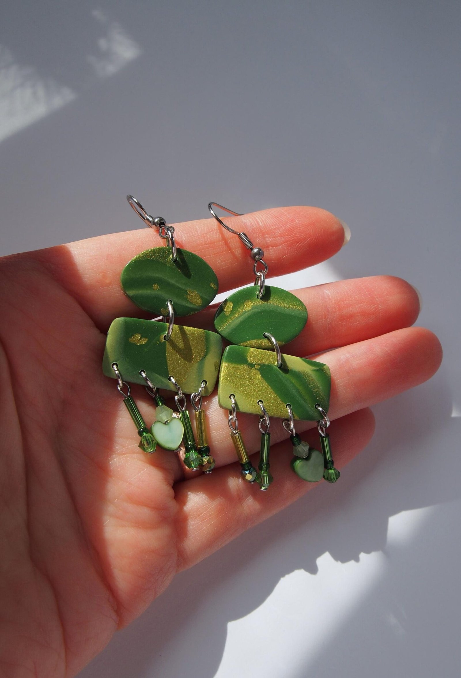 Shimmering Green Boho Earrings: Geometric Heart Dangles - Image 9